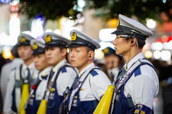Shibuya Crossing is an impressive sight to behold, with police looking on and facilitating the movement of thousands of people at a time.