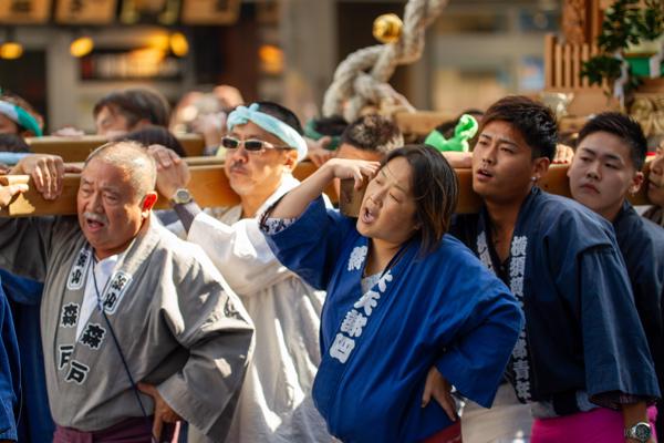 Participants in the Yokosuka Mikoshi Parade in 2018 carry their burden loudly.